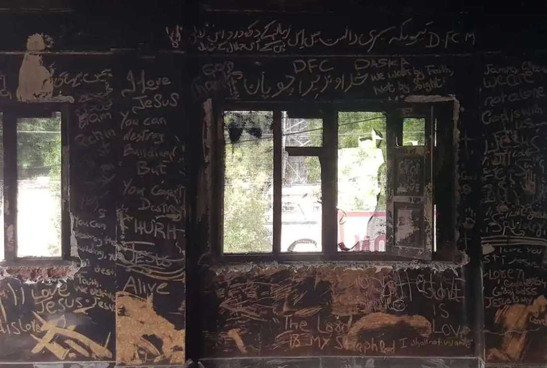 Messages for Christians are written on the ash-covered wall of the Salvation Army Church in Jaranwala, a Christian settlement in Pakistan's Punjab province, where at least 19 churches were destroyed on Aug. 16 during an anti-Christian violence.