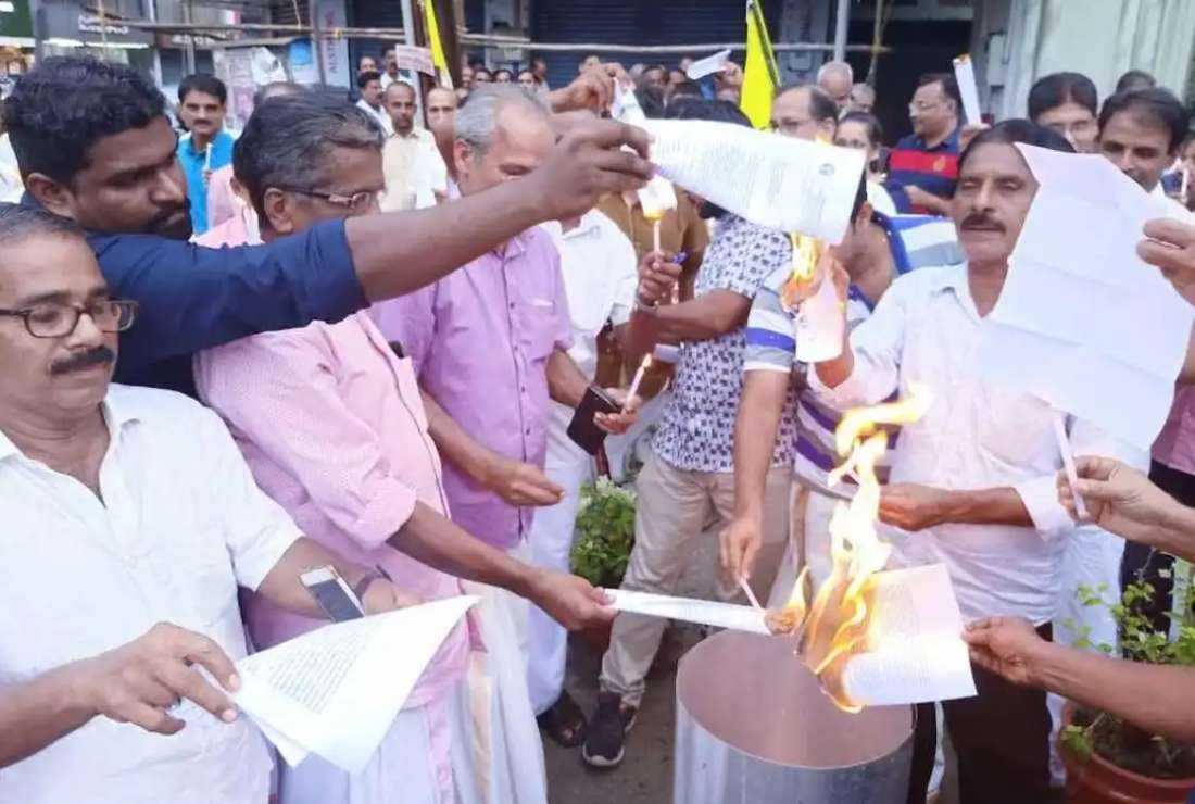 Catholics burn the circular of Archbishop Andrews Thazhath on June 25 in front of St. Mary's Cathedral which is closed since December 2022 over the liturgy dispute.