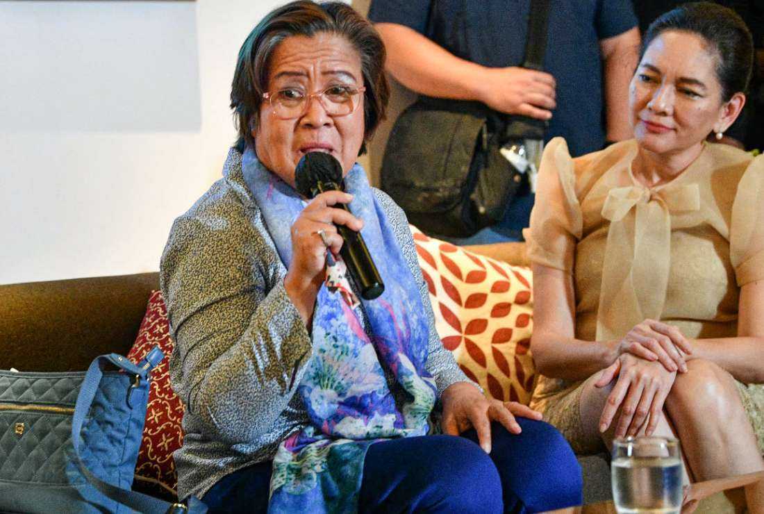  Leila De Lima (left) speaks while Senator Risa Hontiveros listens during a press conference in Manila after her release on Nov 13. 