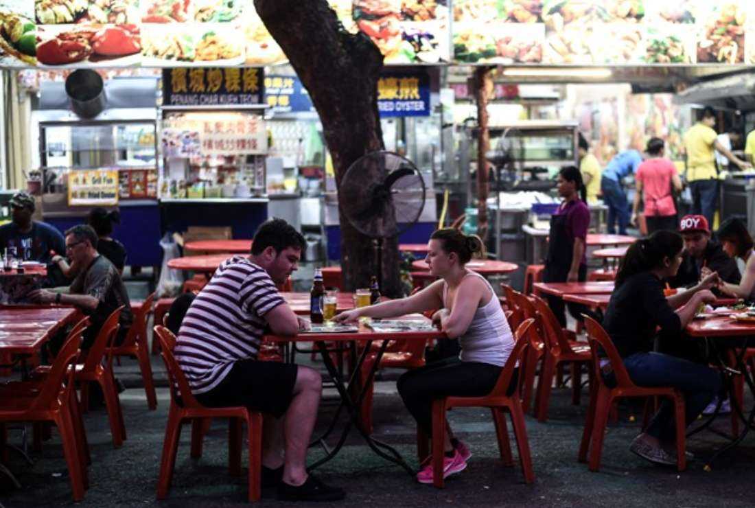Foreign tourists and Malaysians pictured at the popular Jalan Alor food street in central Kuala Lumpur in this file photo dated Sept. 25, 2015.