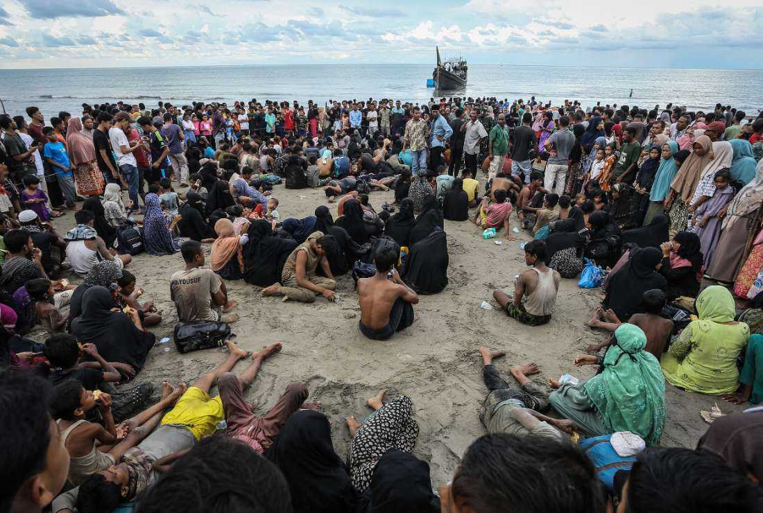 Newly arrived Rohingya refugees rest on the beach after local community decided to temporarily allow them to land for water and food in Ulee Madon, Aceh province, Indonesia, on Nov. 16.