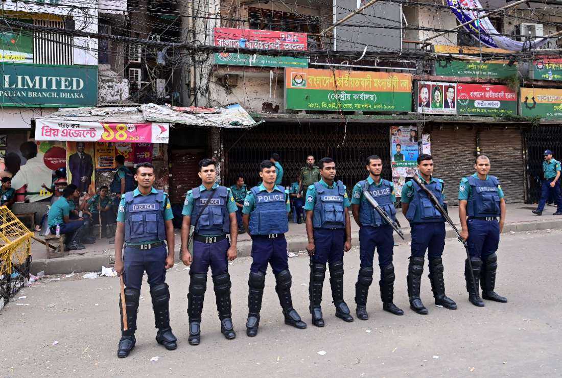 Police personnel stand guard in front of the Bangladesh Nationalist Party (BNP) headquarters during a nationwide transport blockade called by the opposition party, in Dhaka on Nov. 5