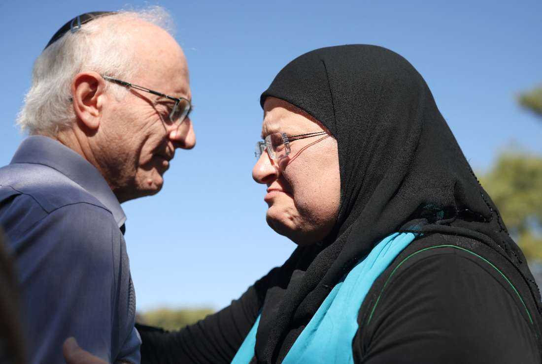 Nir (left), the brother of killed Israeli-Canadian peace activist Vivian Silver, greets Arab-Israeli Ghadir Hani a fellow peace activist from Acre, during her memorial service in Kibbutz Gezer, in central Israel on Nov. 16.