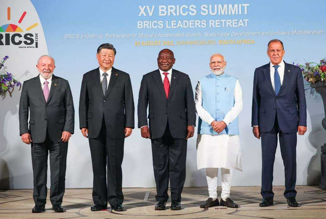 This handout photograph, taken and released by the Russian Foreign Ministry on August 22, 2023, shows (L-R) Brazil's President Luiz Inacio Lula da Silva, China's President Xi Jinping, South Africa's President Cyril Ramaphosa, India's Prime Minister Narendra Modi and Russia's Foreign Minister Sergei Lavrov pose for a group photo during the BRICS Business Forum in Johannesburg.