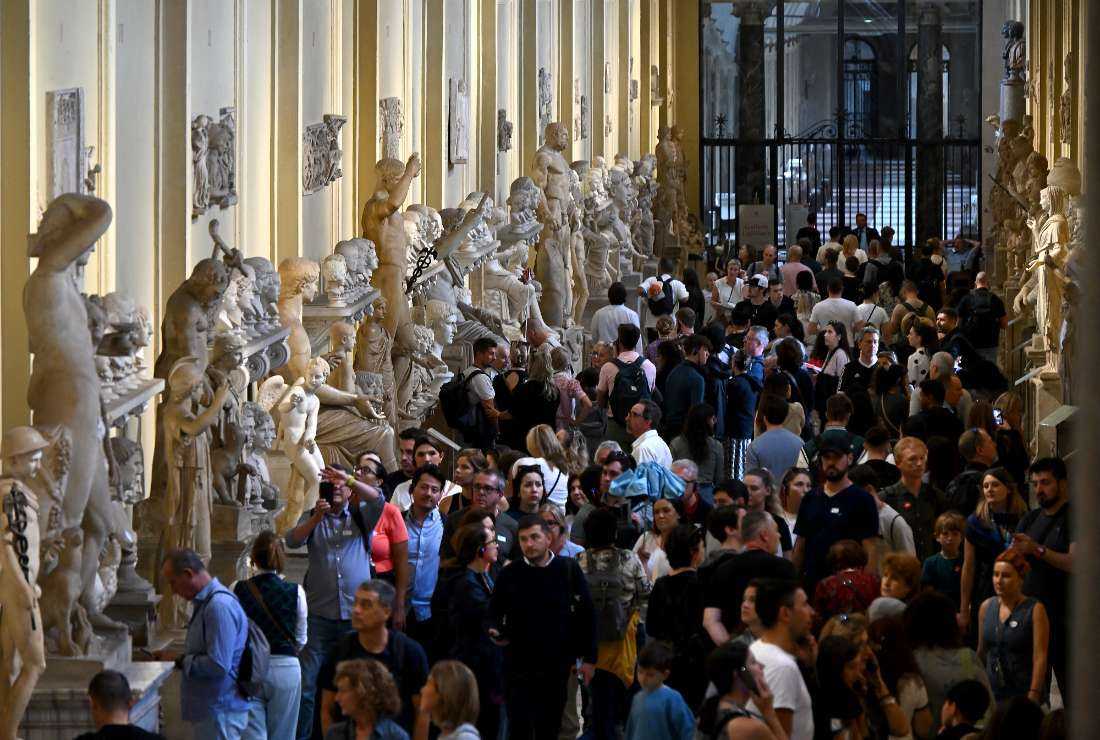 People visit the Vatican Museums in the Vatican.