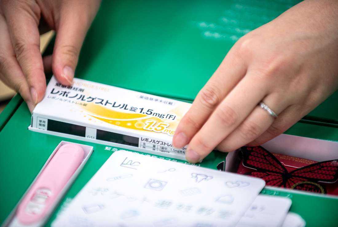 This picture shows a pharmacist Reina Suzuki puts a box of morning after pills into a fertility control kit at a pharmacy in Tokyo.