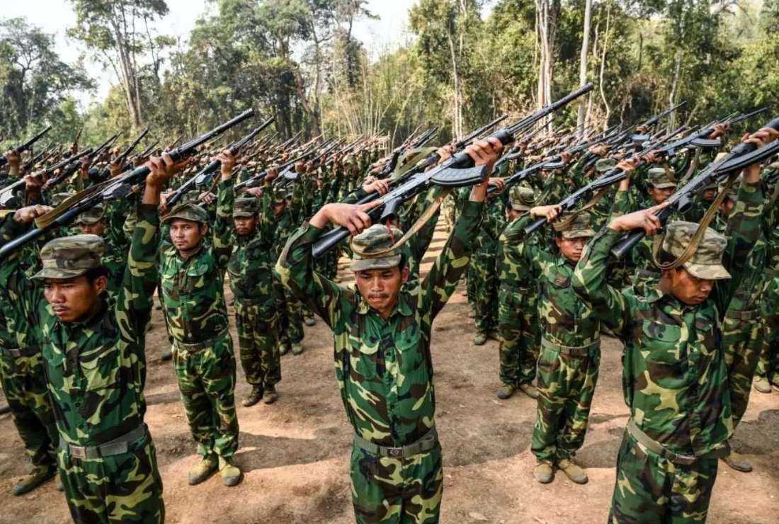 In this photo taken on March 8, members of the ethnic rebel group Ta'ang National Liberation Army (TNLA) take part in a training exercise at their base camp in the forest in Myanmar's northern Shan State
