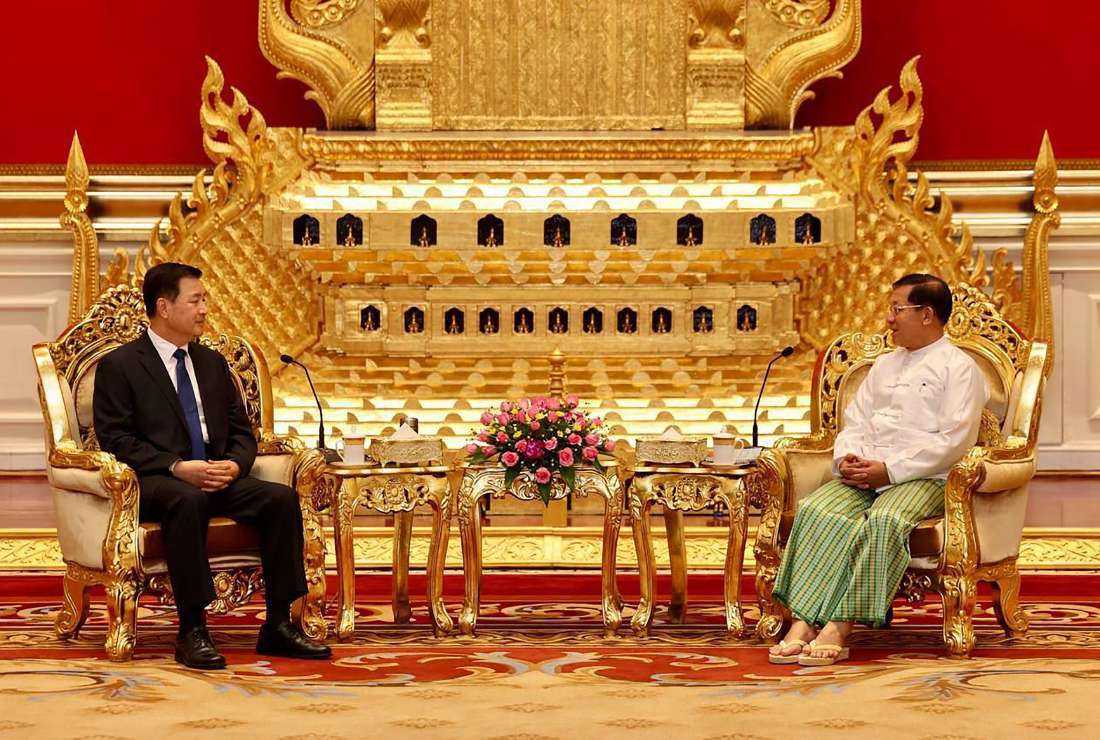 This handout photograph taken on Oct. 31 and released on Nov. 1 by the Myanmar Military Information Team shows Myanmar's military chief Min Aung Hlaing (right) meeting with China's Minister of Public Security Wang Xiaohong in Naypyidaw