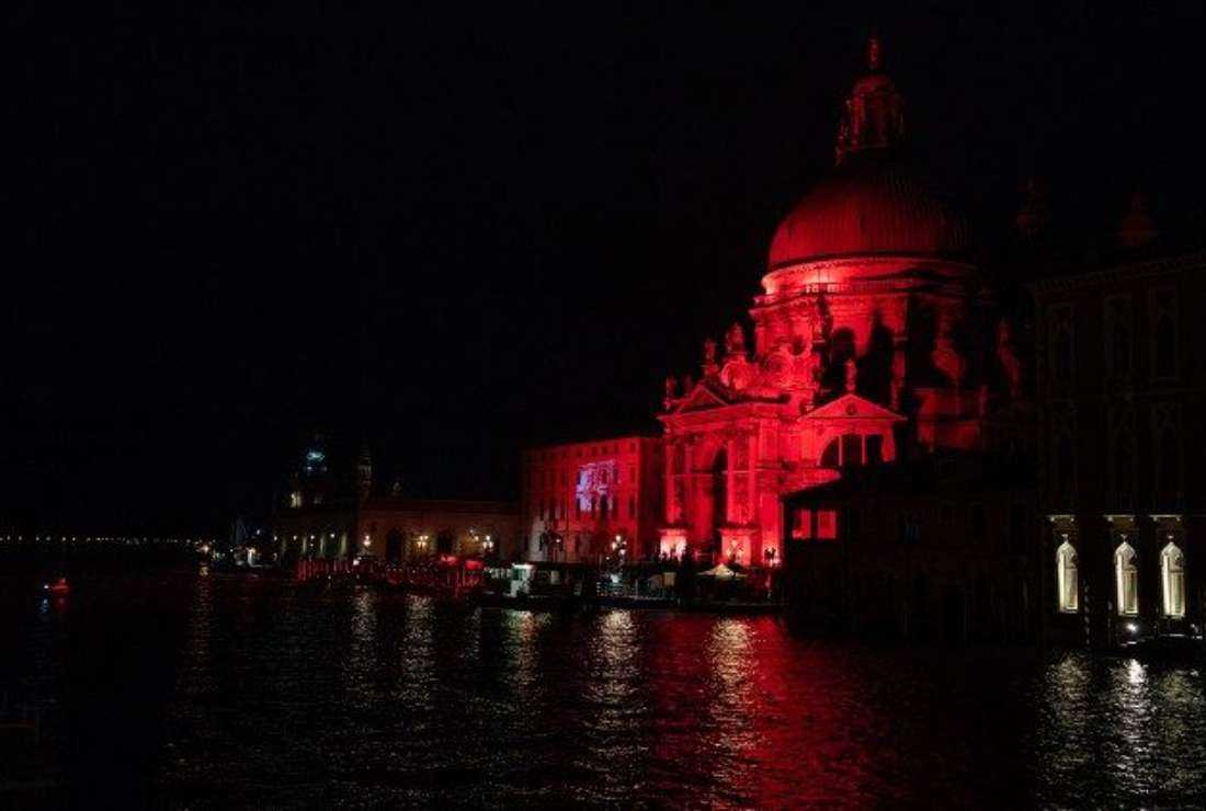 A red-lit building to raise awareness on religious persecution.