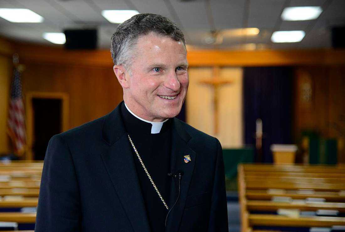 Archbishop Timothy Broglio, Archbishop of the Military Services, smiles during an interview at the chapel on Osan Air Base, Republic of Korea, Aug. 26, 2015.