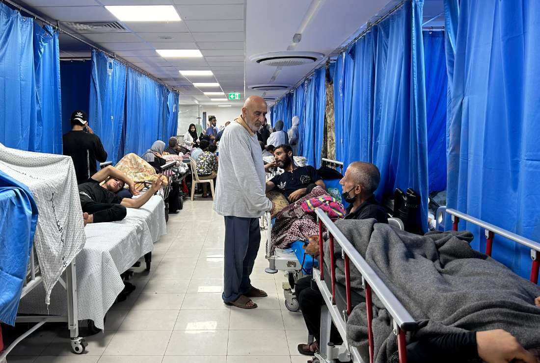 Patients and internally displaced people are pictured at Al-Shifa hospital in Gaza City.