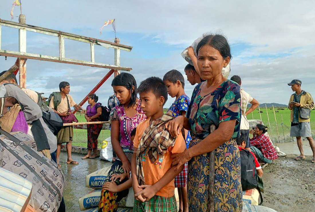 People flee after renewed fighting between Myanmar's military and rebel groups in western Rakhine state on Nov. 19. Christians are skipping Christmas celebrations to show solidarity with displaced persons.
