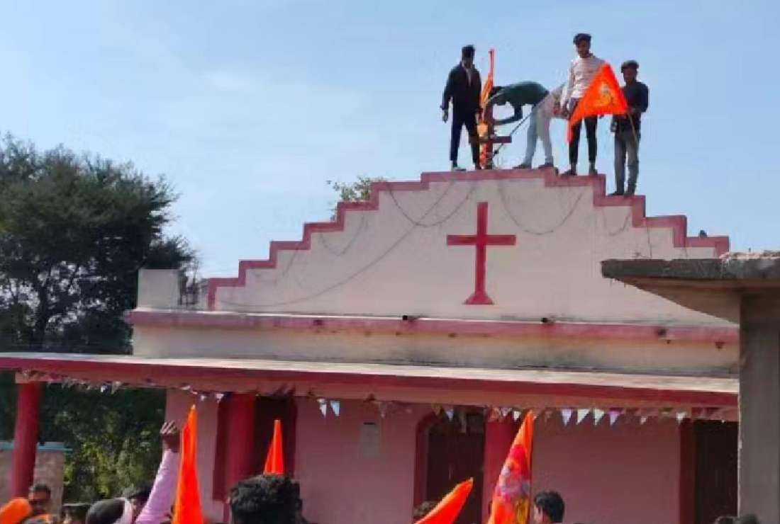 Hindu groups place saffron flags on 4 Indian churches - UCA News