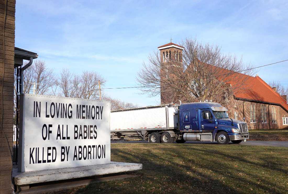  An anti-abortion sign sits in front of St. Patrick's Catholic Church on December 20, 2023, in Winthrop, Iowa. 