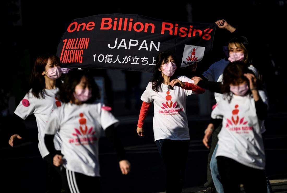 Activists take part in a dance mob as part of the One Billion Rising movement, a global campaign against rape and sexual violence against women, in Tokyo on Feb 14, 2021. 
