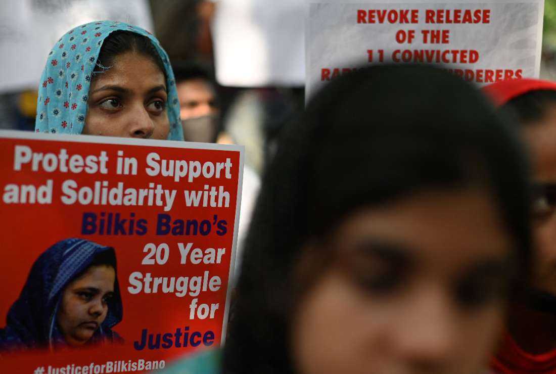 Demonstrators hold placards during a protest against the release of men convicted of gang-raping of Bilkis Bano during the 2002 communal riots in Gujarat, in New Delhi on Aug. 27, 2022. 