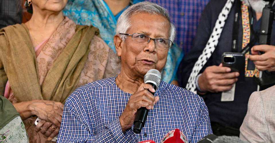 Bangladesh Nobel peace laureate Muhammad Yunus (center) addresses a press conference at his office in Dhaka on Feb. 15