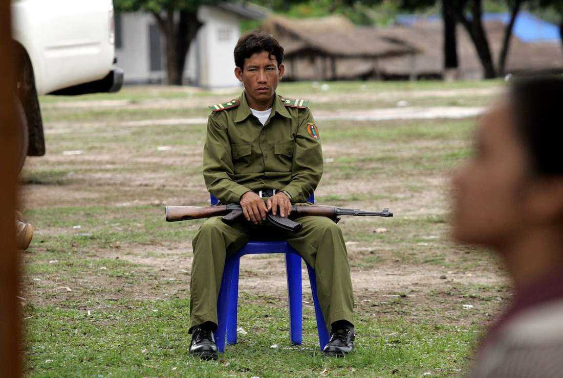 An armed Lao policeman is seen in a village near the capital Vientiane in this file image. Christians in Laos face various forms of abuse in rural areas of Buddhist-majority nation.