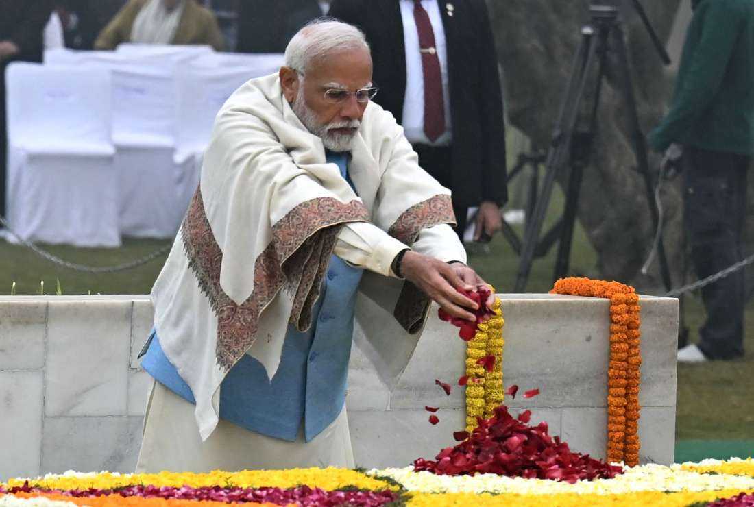 India's Prime Minister Narendra Modi pays his respect at the Mahatma Gandhi memorial at the Rajghat on Gandhi's death anniversary in New Delhi on Jan. 30.