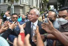 Malaysian ex-PM's jail term halved to six years