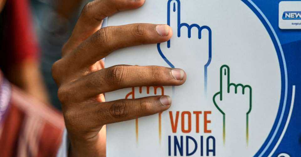 A student holds a placard during a rally in Chennai to create awareness about the importance of voting ahead of the upcoming general election, in India on March 9