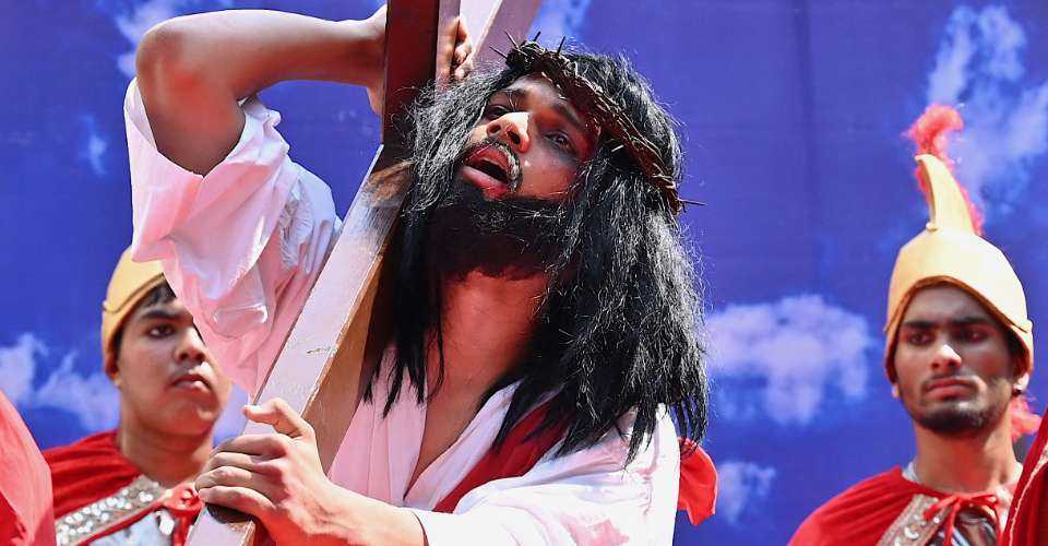 Christians perform a re-enactment of the crucifixion of Jesus Christ on Good Friday in Mumbai on April 7, 2023. 