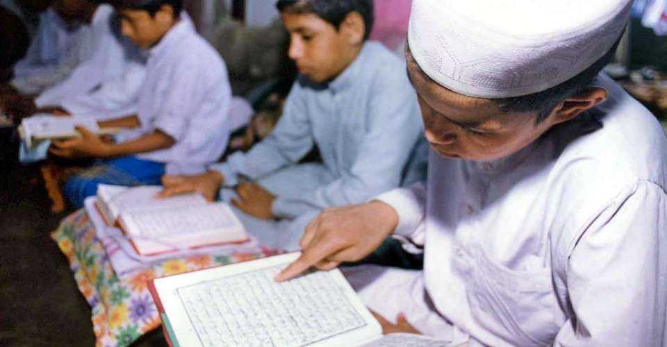 Boys study the Koran at a madrasa or Islamic school in Guwahati in India's northeastern Assam state