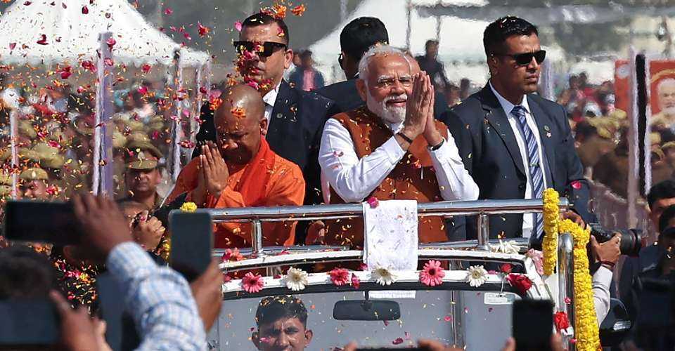 Prime Minister Narendra Modi (center) and Uttar Pradesh Chief Minister Yogi Adityanath (center, left) greet supporters at a function in Varanasi on Feb. 23. Eleven states, most of them ruled by Modi’s pro-Hindu party, have enacted the draconian anti-conversion law.