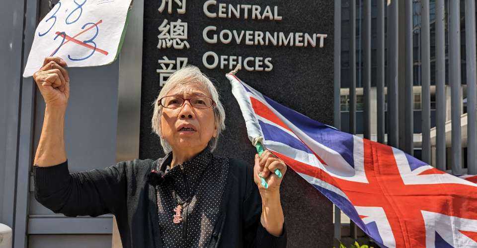 Activist Alexandra Wong, known as Grandma Wong, waves Britain's Union Jack as she holds a solo protest against the national security law in Hong Kong on March 8.