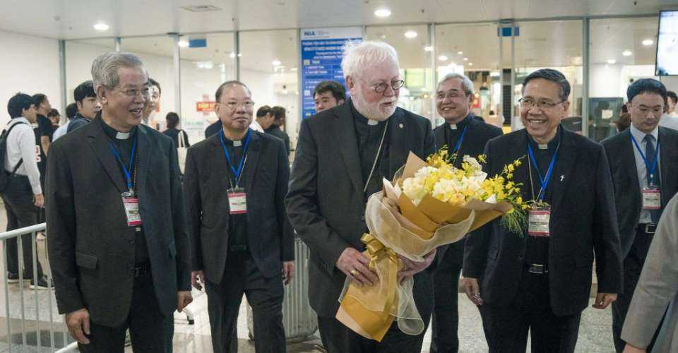 Archbishop Paul Richard Gallagher is welcomed with flowers on his arrival in Hanoi on April 9.