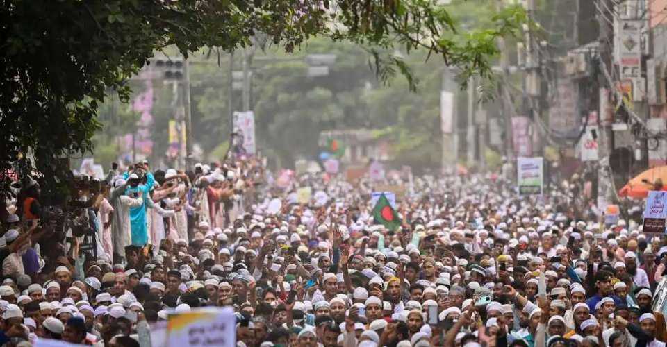 Islamist activists shout anti-India slogans during a demonstration in Dhaka on June 10, 2022, to protest against defamatory remarks against Prophet Muhammad by Indian politician Nupur Sharma. Bangladesh government deployed additional security forces in the central Faridpur district following Hindu mob lynching of two Muslims.