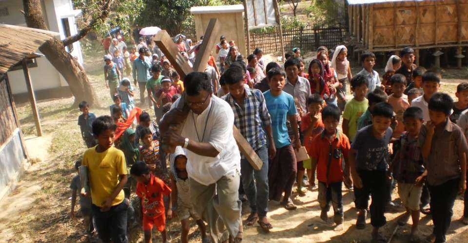 Tribal Catholics follow a priest carrying a cross during a Lenten program in Bandarban district of southeast Bangladesh in this file photo. Tribal communities in Bandarban have been living in fear amid an ongoing insurgency and consequent security operation. 