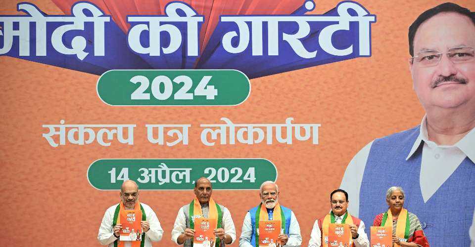 Top leaders of India's Bharatiya Janata Party (BJP) including Prime Minister Narendra Modi (center) release the ruling party's manifesto ahead of the country's general election, at the party headquarters in New Delhi on April 14. 