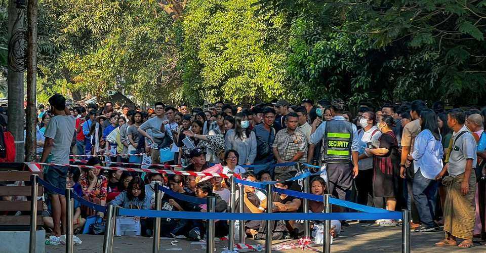 People gather outside the Thai embassy to get visas in Yangon on Feb 16, 2024, after Myanmar's military government said it would impose military service. Generals and ministers attended the opening ceremony marking the start of basic training for conscripts in Naypyitaw on April 8.