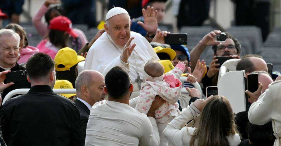 Pope Francis greets the crowd from the popemobile during the weekly general audience on April 10, at St Peter's square in The Vatican.