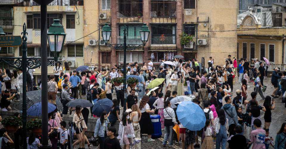 Visitors gather at a tourist spot during the Labour Day holiday in Macau on May 1. Children aged up to 14 among the local population fell from 14.5 percent in 2021 to 13.2 percent in 2023.