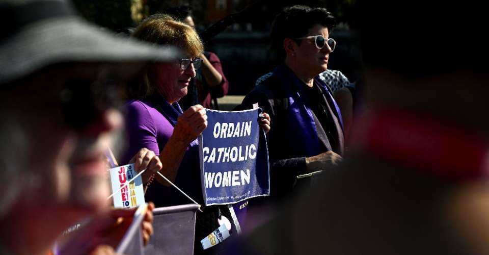 Supporters of the Women's Ordination Conference demonstrate to advocate and pray for the ordination of women as deacons, priests, and bishops into an inclusive and accountable Roman Catholic Church, near the Vatican in Rome on Oct. 6, 2023.