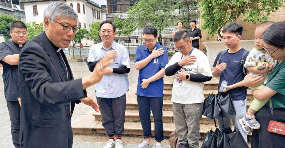 Cardinal Stephen Chow of Hong Kong blesses Catholics outside Sacred Heart of Jesus cathedral in Guangzhou on April 23 during his visit to Guangdong province in southern China.