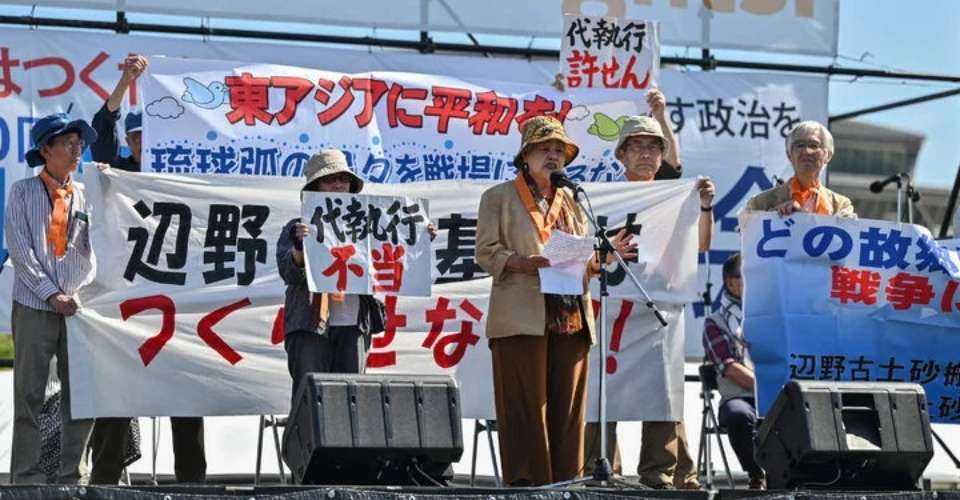 Participants speak against the construction of US military bases in Okinawa, in southern Japan, as they take part in a rally for peace on Constitution Day in Tokyo on May 3.