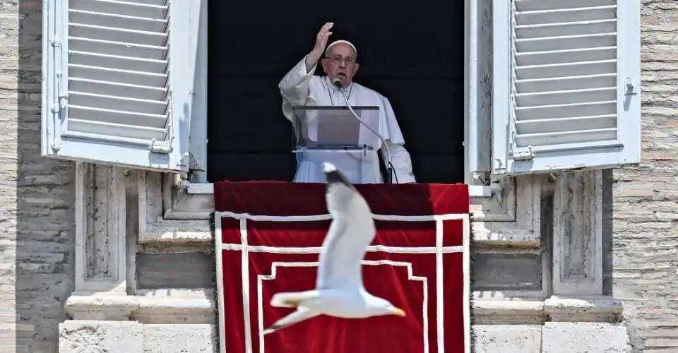 Pope Francis delivers his blessing during the Angelus prayer from the window of the Apostolic Palace overlooking St. Peter's Square, during the Angelus prayer at the Vatican on June 16.