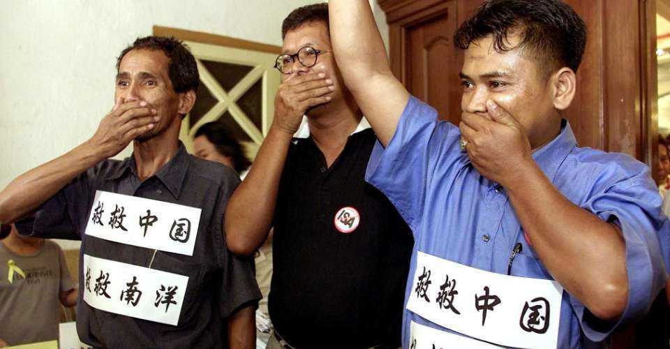 Opposition members protest with banners stuck to their bodies and their hands covering their mouths symbolizing no freedom of speech in Kuala Lumpur, on May 31, 2001. There was much excitement when Anwar Ibrahim in his election campaign promised to remove controls to free the media. Instead, his government’s actions have exacerbated matters.