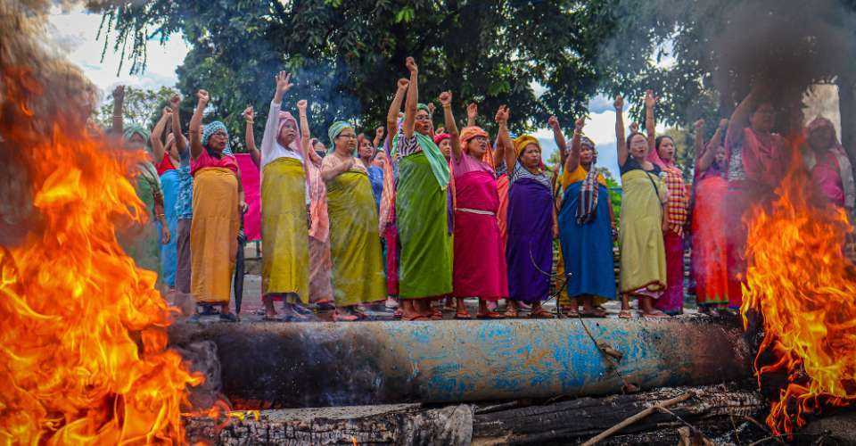 Women protesters shout slogans during a 48-hour general strike in Manipur on Sept. 19, 2023.