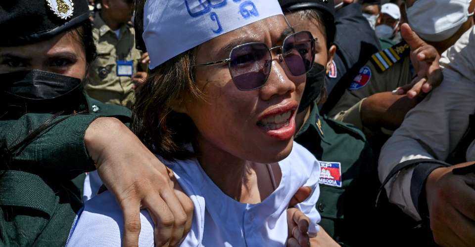 Activist Long Kunthea is arrested outside the Phnom Penh Municipal Court on July 2.