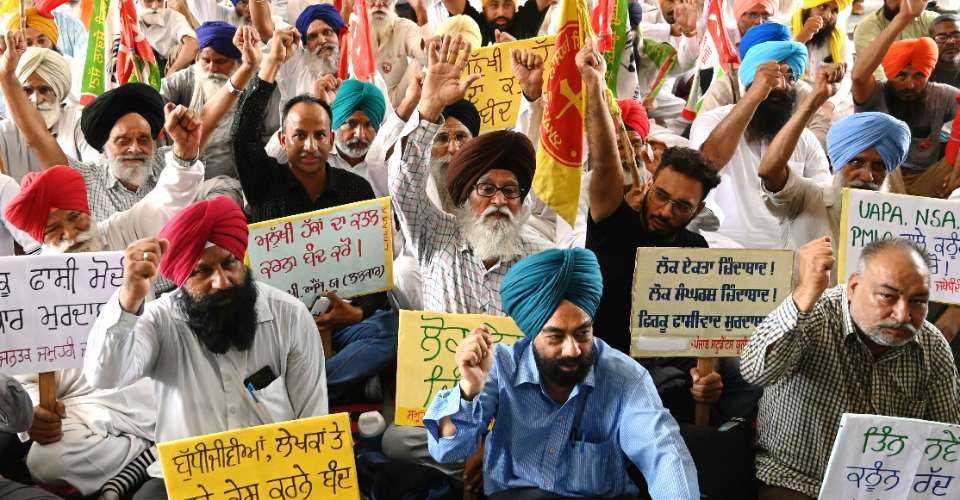 Indian activists from various organizations display placards and shout slogans as they protest against the implementation of three new criminal laws in Amritsar, Punjab state on July 1.