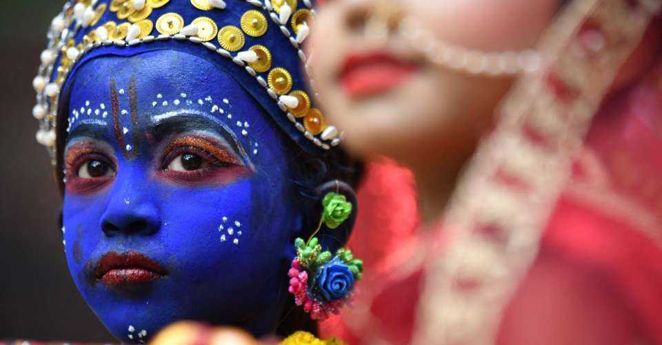 A young child dressed as the Hindu god Lord Krishna takes part in a celebration for the Janmashtami festival in Dhaka on August 19, 2022. Minority Hindus came under a series of attacks during the deadly Bangladesh unrest that topped the Awami League government on Aug. 5.