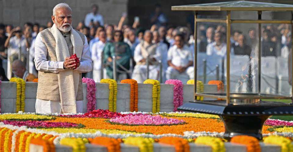 Prime Minister Narendra Modi pays respect on the occasion of Mahatma Gandhi's birth anniversary at his memorial in New Delhi on Oct 2.