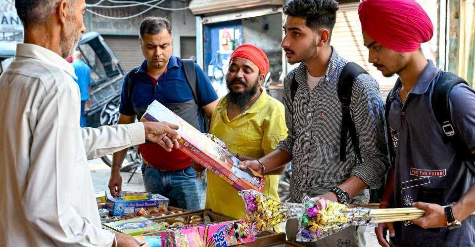 People buy firecrackers on the eve of Diwali, the Hindu festival of lights, in Amritsar on Oct. 30.