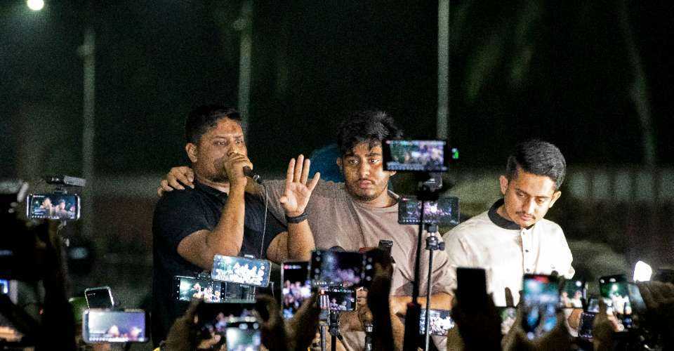 Student leaders and activists address protestors during a demonstration outside the residence of Bangladesh's president Mohammed Shahabuddin, demanding his resignation amid accusations of his residual loyalty to the toppled premier Sheikh Hasina, in Dhaka on Oct. 22.