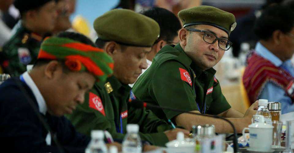 Leaders of the Arakan Army, an ethnic rebel group, gather with other rebel leaders and representatives of various Myanmar ethnic rebel groups at the opening of a four-day conference in Mai Ja Yang, a town controlled by the Kachin Independence Army (KIA) in northern Kachin State on July 26, 2016.