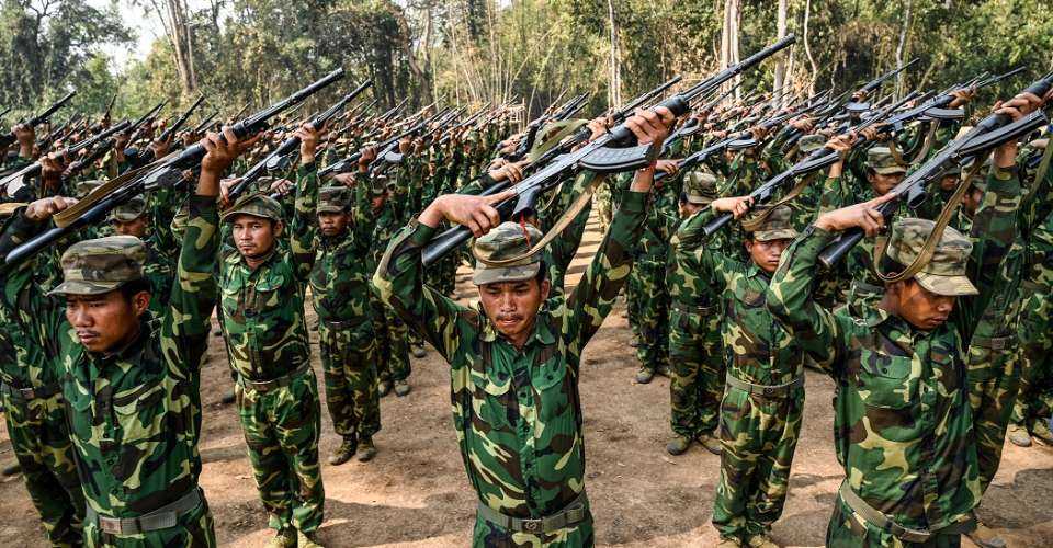 In this photo taken on March 8, 2023 members of the Ta'ang National Liberation Army (TNLA) ethnic rebel group take part in a training exercise at their base camp in the forest in Myanmar's northern Shan State. 